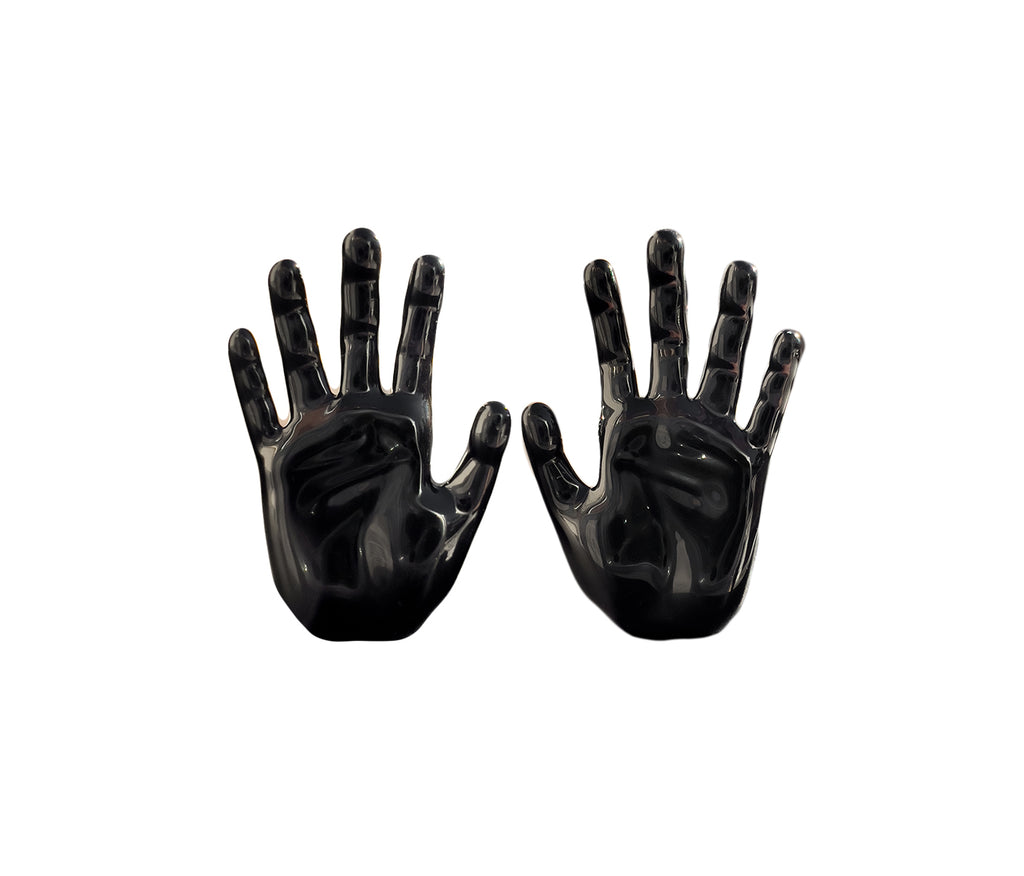 goth jewelry, black enamel coated stud hand earrings with palm facing forward, right and left hand stand next to each other both hand painted in black enamel